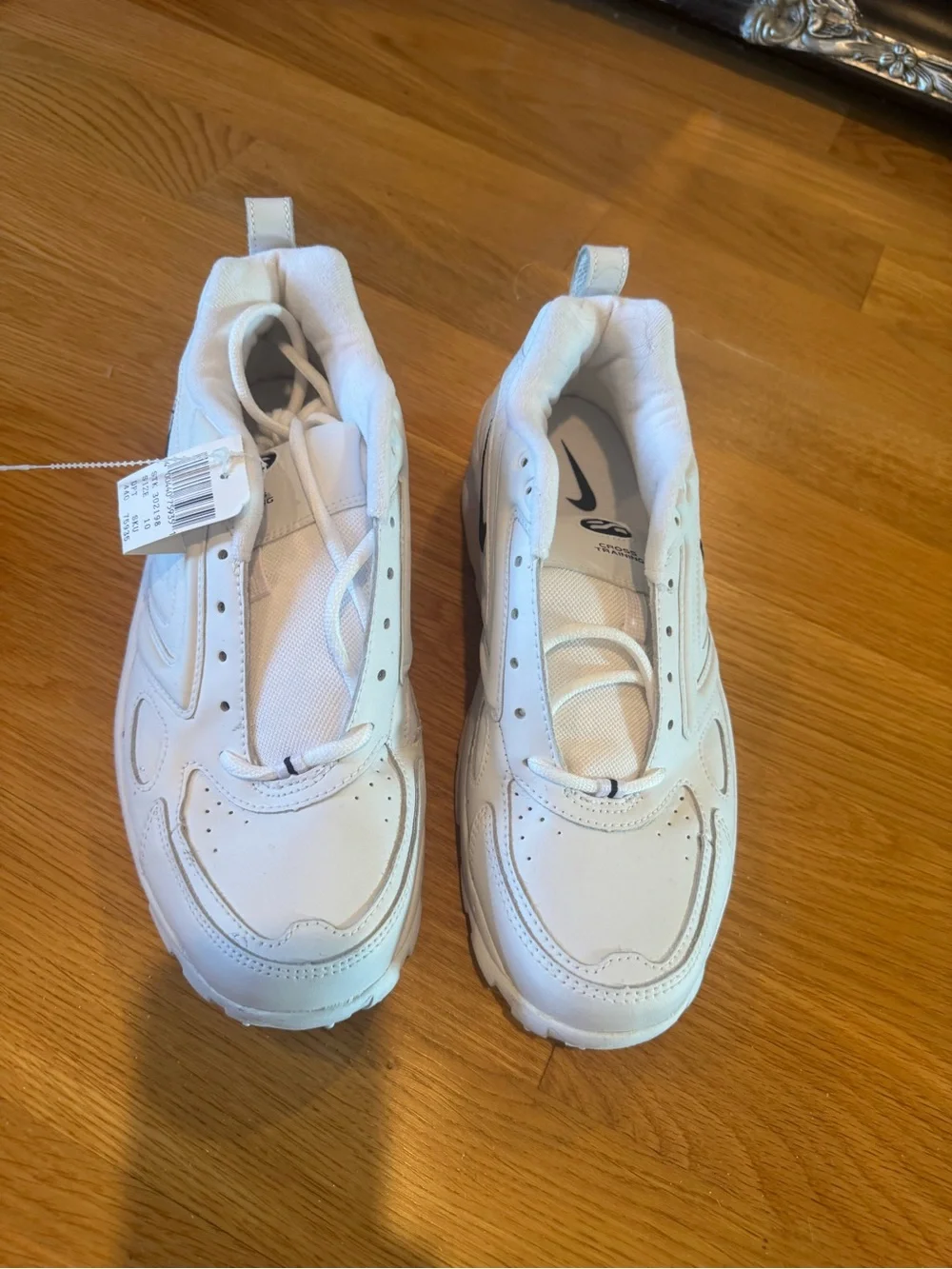 Nike Men’s White Sneakers with dark navy Swoosh